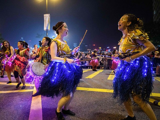 Performers take part in the annual Lunar New Year parade in the Kowloon district of Hong Kong on February 5, 2019 to mark the Year of the Pig. (Photo by Anthony WALLACE / AFP) (Photo credit should read ANTHONY WALLACE/AFP via Getty Images)