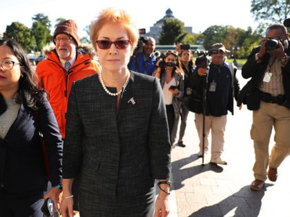 WASHINGTON, DC - OCTOBER 11: Former U.S. Ambassador to Ukraine Marie Yovanovitch (C) is surrounded by lawyers, aides and journalists as she arrives at the U.S. Capitol October 11, 2019 in Washington, DC. Yovanovitch was invited to testify behind closed doors to the House Intelligence, Foreign Affairs and Oversight committees …