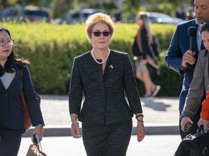 FILE - In this Oct. 11, 2019, file photo, former U.S. ambassador to Ukraine Marie Yovanovitch, center, arrives on Capitol Hill, Friday, Oct. 11, 2019, in Washington, to testify before congressional lawmakers as part of the House impeachment inquiry into President Donald Trump. (AP Photo/J. Scott Applewhite, File)
