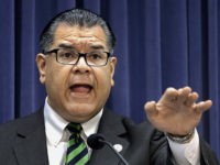FILE - In this March 25, 2014 file photo, Illinois Sen. Martin Sandoval, D-Cicero, speaks during a news conference at the Illinois state Capitol, in Springfield, Ill. The Illinois Senate is urging Gov. Bruce Rauner to reject a presidential call to send National Guard troops to help secure the U.S.-Mexican …