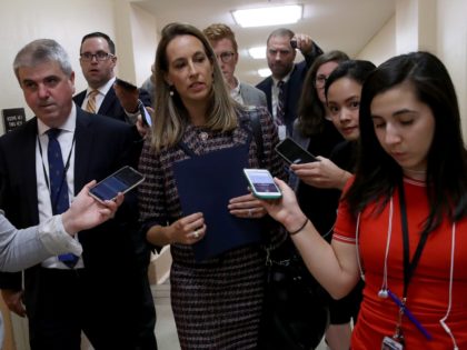WASHINGTON, DC - SEPTEMBER 24: Rep. Mikie Sherrill (C) (D-NJ) is trailed by reporters after leaving a House Democratic caucus meeting at the U.S. Capitol where formal impeachment proceedings against U.S. President Donald Trump were announced by Speaker of the House Nancy Pelosi September 24, 2019 in Washington, DC. Sherrill …