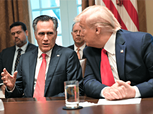 President Donald Trump, right, listens as Sen. Mitt Romney, R-Utah, third from left, speak