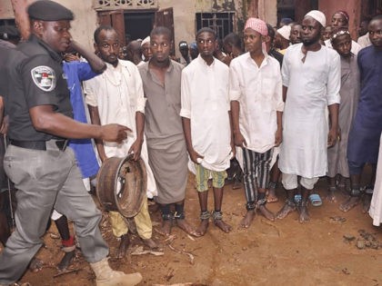 Some of the 300 male students of "different nationalities" are pictured on September 26, 2019 in the Rigasa area of Kaduna in northern Nigeria after being rescued by police from an Islamic seminary where they were tortured and sodomised. - Officers raided a building today where the victims including adults …