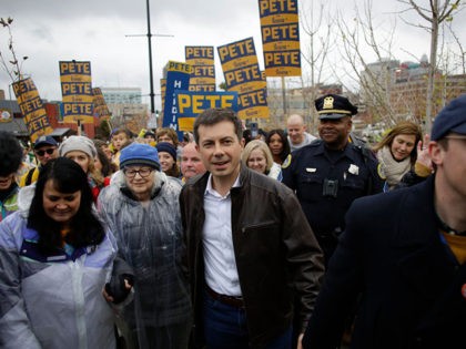 DES MOINES, IA - NOVEMBER 01: Democratic presidential candidate, South Bend, Indiana Mayor Pete Buttigieg (C) walks with his husband Chasten Buttigieg (R) before the Iowa Democratic Party Liberty & Justice Celebration on November 1, 2019 in Des Moines, Iowa. Fourteen presidential are expected to speak at the event addressing …