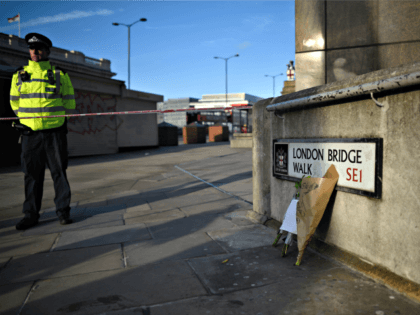 LONDON, ENGLAND - NOVEMBER 30: Flowers rest against a wall at the scene of yesterday's London Bridge stabbing attack on November 30, 2019 in London, England. A man and a woman were killed and three seriously injured in a stabbing attack at London Bridge during which the suspect was shot …