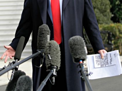 US President Donald Trump reads from his notes as he talks to the media on the South Lawn of the White House before boarding Marine One in Washington, DC, November 20, 2019, en route to Austin, Texas. (Photo by Joshua Lott / AFP) (Photo by JOSHUA LOTT/AFP via Getty Images)