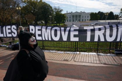 Activists hold a banner asking for the impeachment of US President Donald Trump on November 5, 2019 in front of the White House in Washington,DC. - US voters headed to polls Tuesday in several states with governorships or legislatures at stake, in early tests of enthusiasm for and against President …