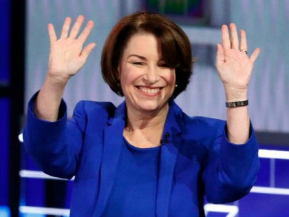 Democratic presidential candidate Sen. Amy Klobuchar, D-Minn., waves before a Democratic p