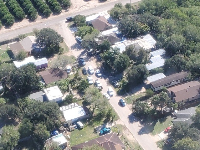 A U.S. Customs and Border Protection Air and Marine Operations aircrew provides air cover over a human smuggling stash house raid in Edinburg, Texas. (Photo: Bob Price/Breitbart Texas)