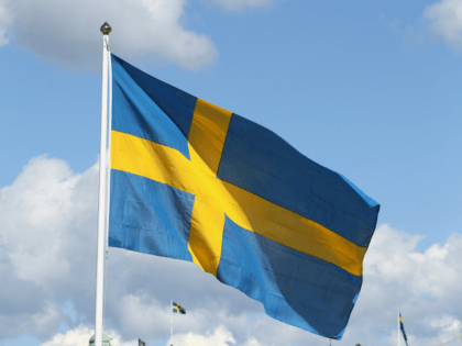 STOCKHOLM, SWEDEN - JUNE 08: A Swedish flag outside the Royal Palace ahead of the wedding