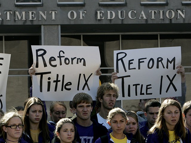 Students from James Madison University take part in a rally outside the Education Department in Washington, Thursday, Nov. 2, 2006. Earlier this year, James Madison announced that it would drop 10 of its athletic teams in order to bring the school into compliance with the federal law demanding equity in …