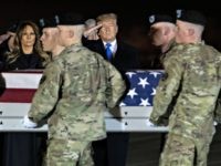 President Donald Trump and first lady Melania Trump look on as a U.S. Army carry team moves a transfer case containing the remains of Chief Warrant Officer 2 David C. Knadle, of Tarrant, Texas, who according to the Department of Defense died in Afghanistan, during a casualty return ceremony, Thursday, …