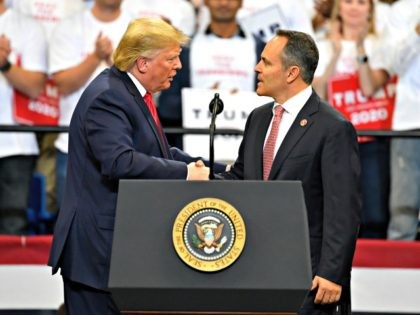 President Donald Trump, left, shakes hands with Kentucky Gov. Matt Bevin during a campaign rally in Lexington, Ky., Monday, Nov. 4, 2019. (AP Photo/Timothy D. Easley)