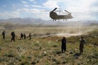 A US military Chinook helicopter lands on a field outside the governor's palace during a visit by the commander of US and NATO forces in Afghanistan. THOMAS WATKINS/AFP/GETTY IMAGES/AFP/GETTY IMAGES