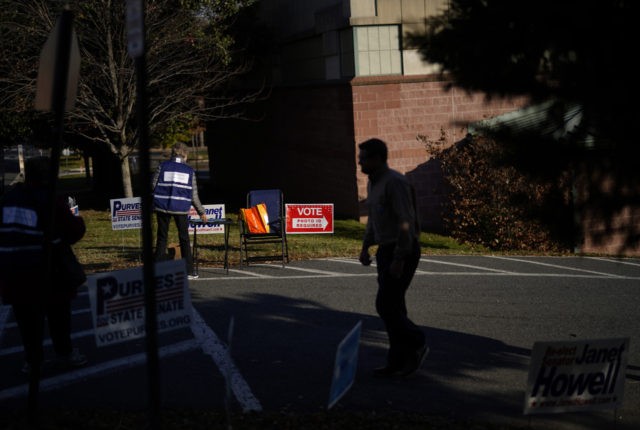 ARLINGTON, VIRGINIA - NOVEMBER 05: Virginia voters exit a polling station at Nottingham E