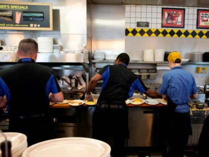 Cooks at Waffle House prepare food at a Waffle House Restaurant on September 13, 2018 in Conway, South Carolina. - Hurricane Florence edged closer to the east coast of the US Thursday, with tropical-force winds and rain already lashing barrier islands just off the North Carolina mainland. The huge storm …