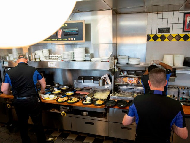 Cooks at Waffle House prepare food at a Waffle House Restaurant on September 13, 2018 in Conway, South Carolina. - Hurricane Florence edged closer to the east coast of the US Thursday, with tropical-force winds and rain already lashing barrier islands just off the North Carolina mainland. The huge storm …