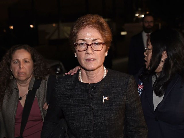 Former US Ambassador to Ukraine Marie Yovanovitch (C) flanked by lawyers, aides and Capitol police, leaves the US Capitol October 11, 2019 in Washington, DC after testifying behind closed doors to the House Intelligence, Foreign Affairs and Oversight committees as part of the ongoing impeachment investigation against President Donald Trump. …