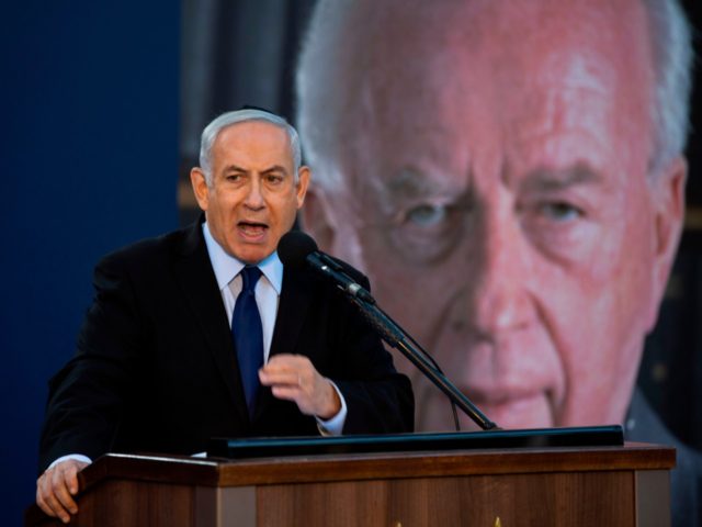 Israeli Prime Minister Benjamin Netanyahu speaks during a state memorial ceremony for form