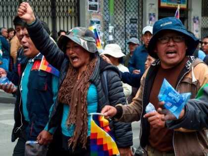 Supporters of Bolivian ex-President Evo Morales and locals discontented with the political situation march during a protest from El Alto to La Paz on November 13, 2019. - Bolivia's exiled ex-president Evo Morales said Wednesday he was ready to return to "pacify" his country amid weeks of unrest that led …