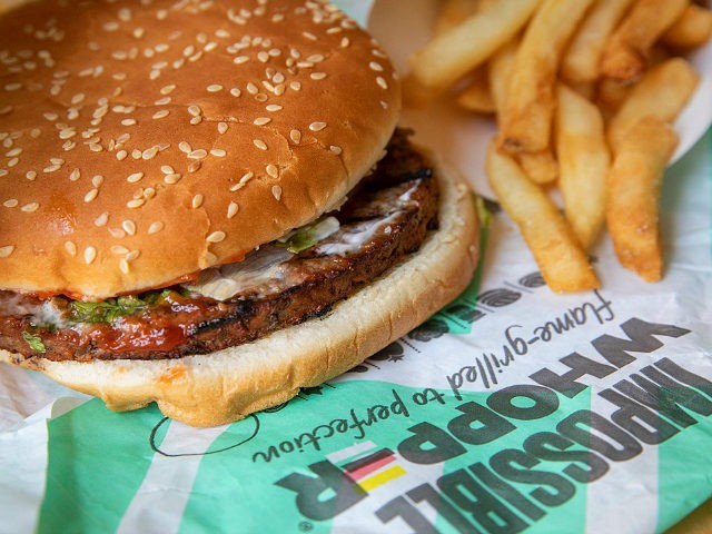 NEW YORK, NY - AUGUST 8: In this photo illustration, the new Impossible Whopper sits on a table on August 8, 2019 in the Brooklyn borough of New York City. On Thursday, Burger King is launching its soy-based Impossible Whopper at locations nationwide. The meatless patties are produced by California …