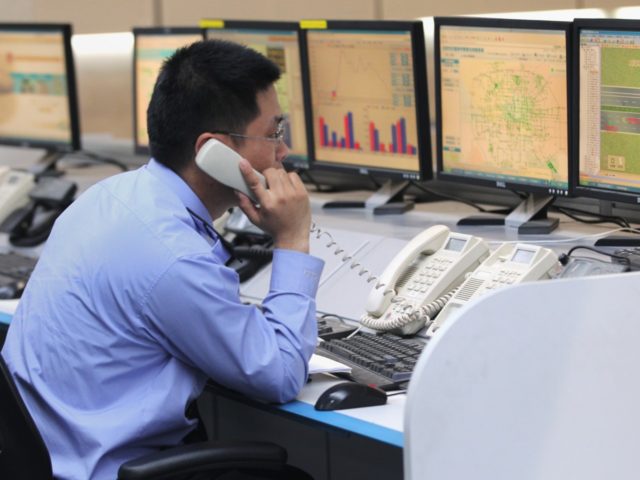 BEIJING, CHINA - MAY 12: Police work in the alarm center at the Beijing traffic Police Com