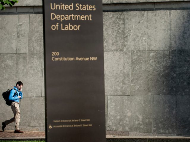 A man walks by the US Department of Labor building on May 3, 2013 in Washington, DC. A solid job creation report for April and a fall in the jobless rate to 7.5 percent sweetened the picture for the US economy Friday, amid worries that it has tumbled into a …
