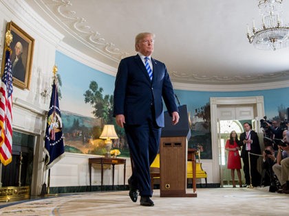 TOPSHOT - US President Donald Trump leaves after announcing his decision about the nuclear deal with Iran during a speech from the Diplomatic Reception Room at the White House in Washington, DC, May 8, 2018. - Trump on Tuesday announced the US withdrawal from what he called the "defective" multinational …