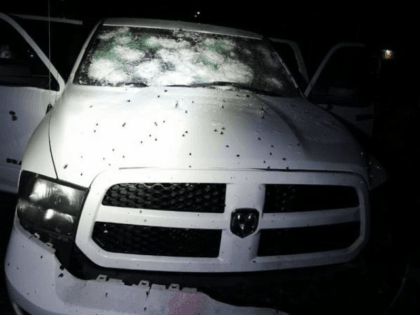 A police vehicle riddled with hundreds of rounds of gunfire in central Mexico. (Police photo)