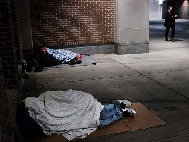 PHILADELPHIA, PA - OCTOBER 18: Homeless people sleep on a sidewalk on October 18, 2018 in