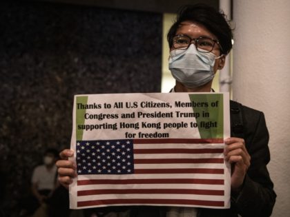 HONG KONG, CHINA - NOVEMBER 28: A pro-democracy protester holds a thank you sign during a