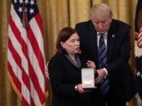 WASHINGTON, DC - NOVEMBER 07: U.S. President Donald Trump presents the Presidential Citizens Medal to Susan Rescorla, wife of Richard Cyril Rescorla, during an East Room event at the White House November 7, 2019 in Washington, DC. Richard Cyril Rescorla, former director of security for Morgan Stanley, was awarded the …