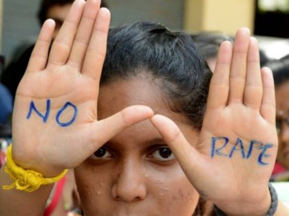 Indian students of Saint Joseph Degree college participate in an anti-rape protest in Hyderabad on September 13, 2013. The judge hearing the case of four men convicted for a shocking gang rape on a bus in New Delhi in December 2012 sentenced them to death. AFP PHOTO / Noah SEELAM …