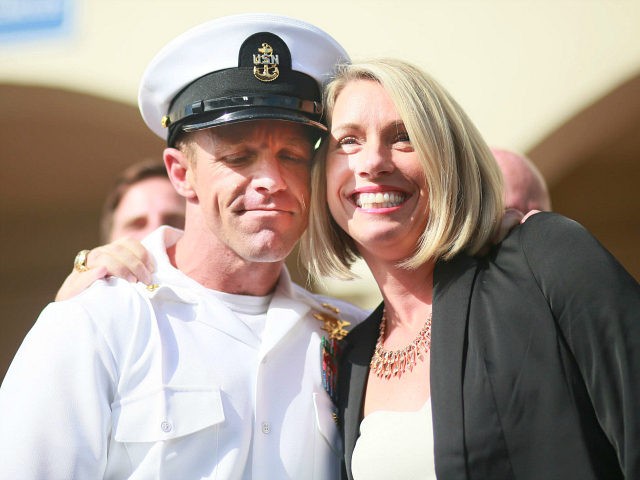SAN DIEGO, CA - JULY 02:R, Navy Special Operations Chief Edward Gallagher celebrates with his wife Andrea after being acquitted of premeditated murder at Naval Base San Diego July 2, 2019 in San Diego, California. Gallagher was found not guilty in the killing of a wounded Islamic State captive in …
