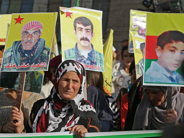 Syrian Kurdish demonstrators take to the streets of the northeastern city of Qamishli, the