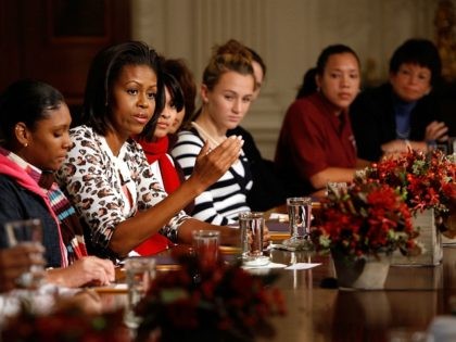 WASHINGTON - NOVEMBER 02: First lady Michelle Obama (C) speaks to a group of female studen