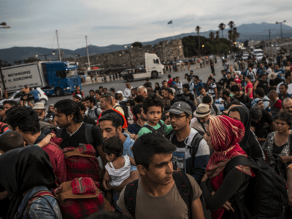 KOS, GREECE - JUNE 04: Hundreds of migrant men, women and children along with tourists and