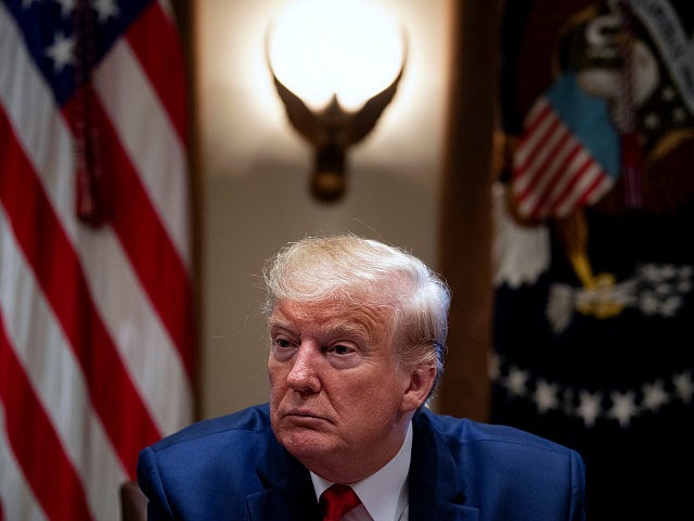 US President Donald Trump listens during a meeting in the Cabinet Room of the White House