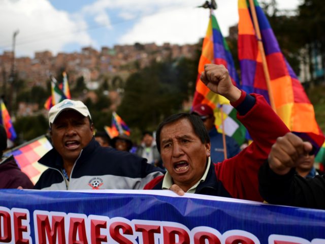Supporters of Bolivian ex-President Evo Morales march during a protest from El Alto to La Paz on November 13, 2019. - Bolivian senator Jeanine Anez proclaimed herself Bolivia's interim president on the eve, in an effort to fill the power vacuum left by the abrupt resignation of Evo Morales, who …