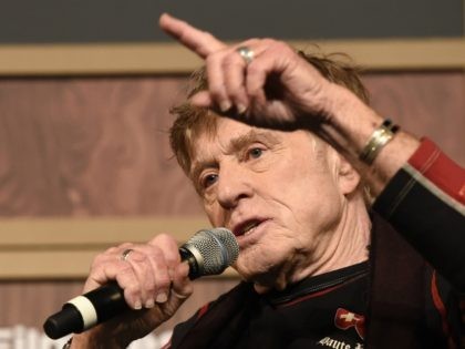 Robert Redford, founder and president of the Sundance Institute, answers a reporter's