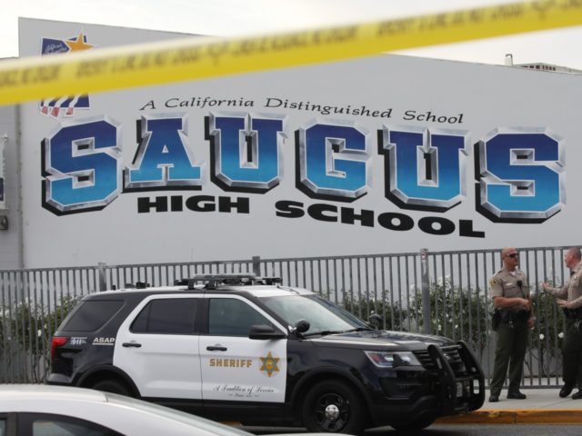 SANTA CLARITA, CALIFORNIA - NOVEMBER 15: L.A. County Sheriff's Deputies are positioned at Saugus High School a day after a deadly shooting there on November 15, 2019 in Santa Clarita, California. The shooting left two students dead and others wounded while a suspect in the shooting is being treated at …