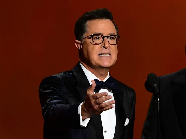 Stephen Colbert (L) and Jimmy Kimmel speak onstage during the 71st Emmy Awards at the Microsoft Theatre in Los Angeles on September 22, 2019. (Photo by Frederic J. BROWN / AFP) (Photo credit should read FREDERIC J. BROWN/AFP via Getty Images)