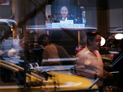 A television in a restaurant shows Ambassador to the European Union Gordon Sondland as he testifies in the public hearing in the impeachment inquiry of President Donald Trump on November 20, 2019 in New York City, United States. Across the nation Americans are tuning in to watch the rare impeachment …