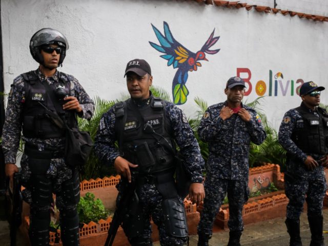 VENEZUELA-BOLIVIA-CRISIS-OPPOSITION-PROTEST-GUAIDO Members of Venezuela's Boliviarian National Police stand guard outside the Bolivian embassy in Caracas where opposition leader and self-proclaimed acting president Juan Guaido holds a gathering with supporters on November 16, 2019. - Venezuela's opposition called to protest against President Nicolas Maduroon Saturday, while the government also called on …