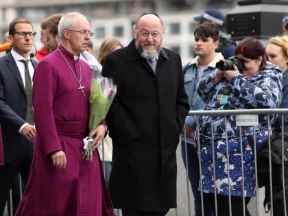 Archbishop of Canterbury Justin Welby (2nd R) and Chief Rabbi Ephraim Mirvis (R) join othe