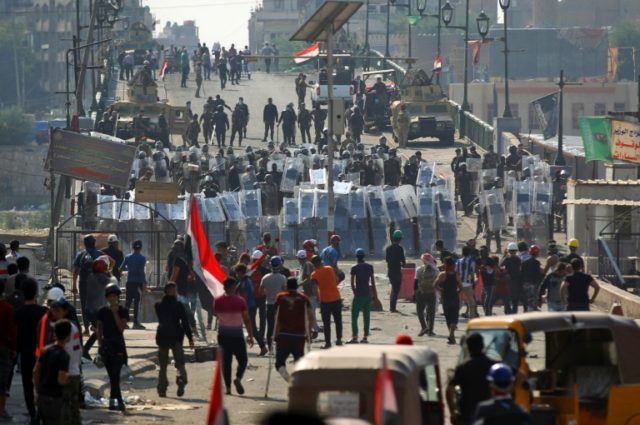 Seven dead in Iraq as security forces clear protest sites