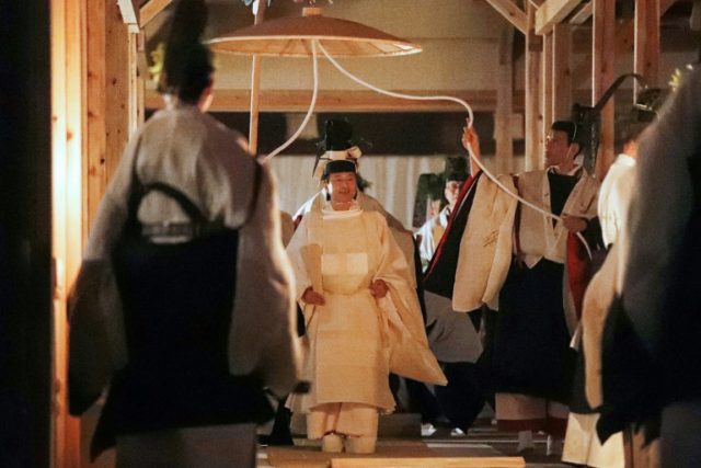 Japan's emperor performs thanksgiving rite with Sun Goddess