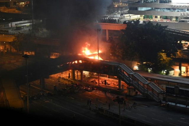 Protesters set fire to hold off police at Hong Kong campus