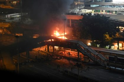 Fires rage around besieged Hong Kong campus as protesters dig-in