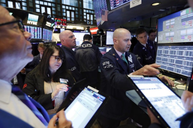 Financial Markets Wall Street Mario Picone Specialist Mario Picone, right, works with traders at his post on the floor of the New York Stock Exchange, Wednesday, Nov. 20, 2019. Stocks are opening slightly lower on Wall Street led by declines in technology and communications companies. (AP Photo/Richard Drew) The Associated Press